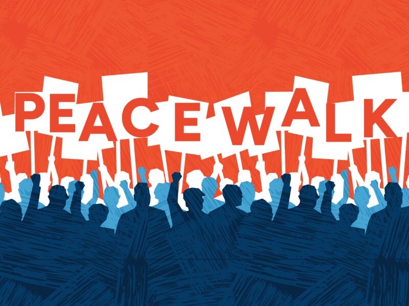 silhouettes holding signs that read "peace walk"