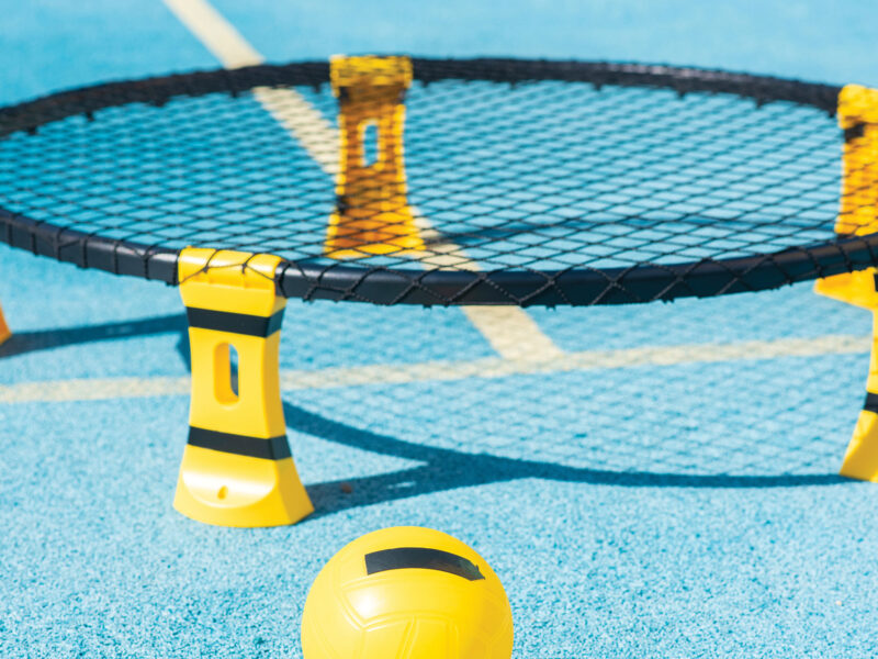 Spikeball set on blue ground.