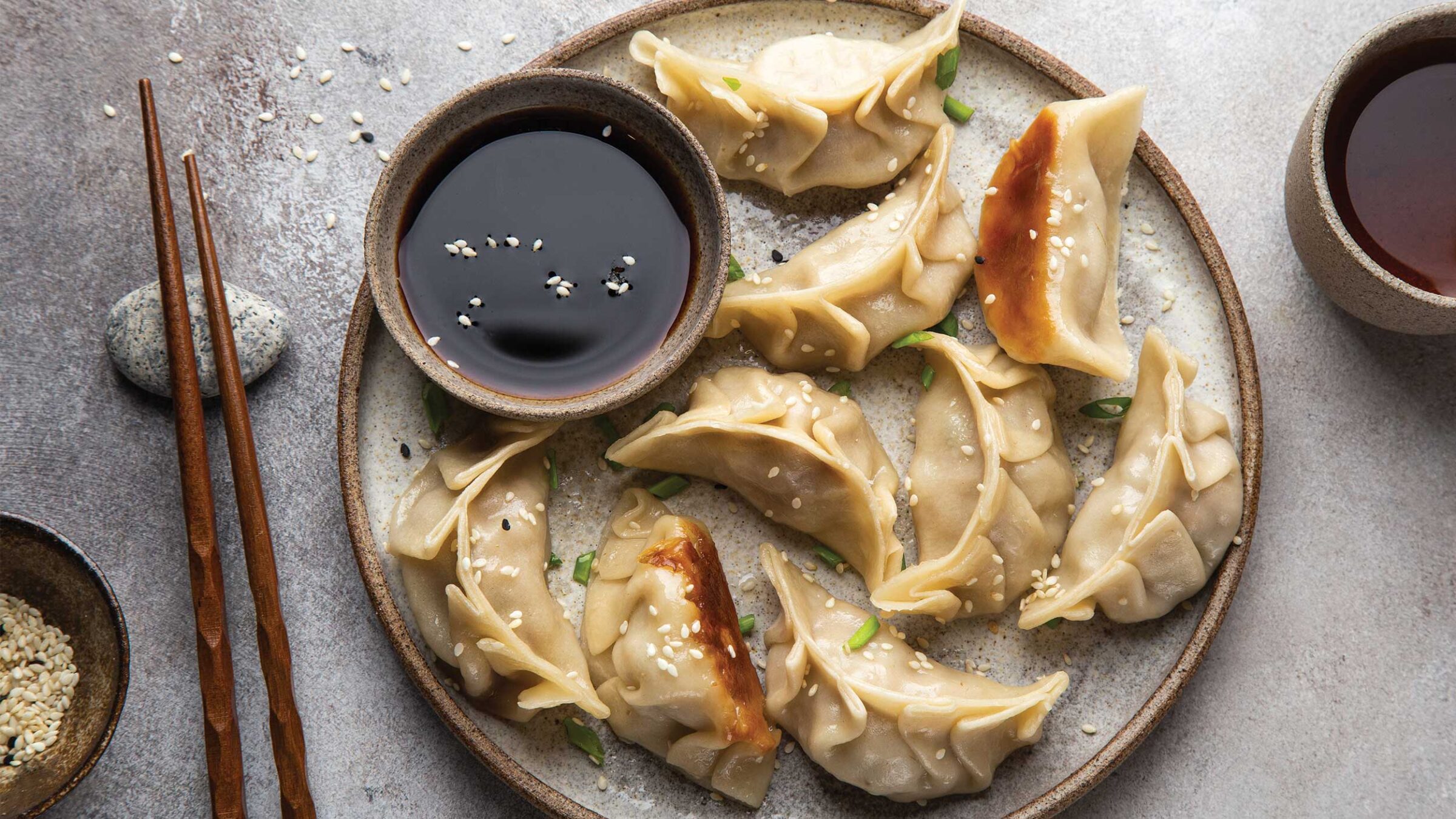 dumplings on a plate with chopsticks