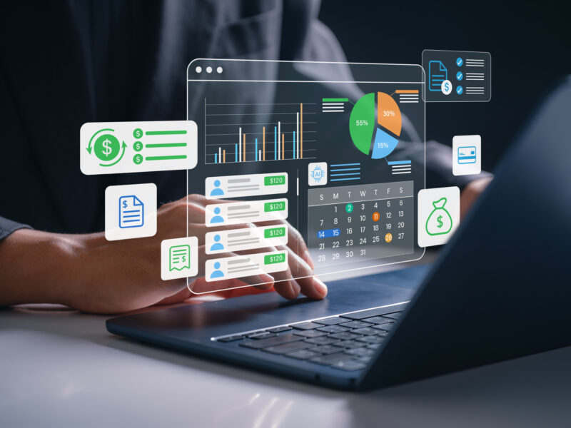 budgeting symbols shown in front of a laptop