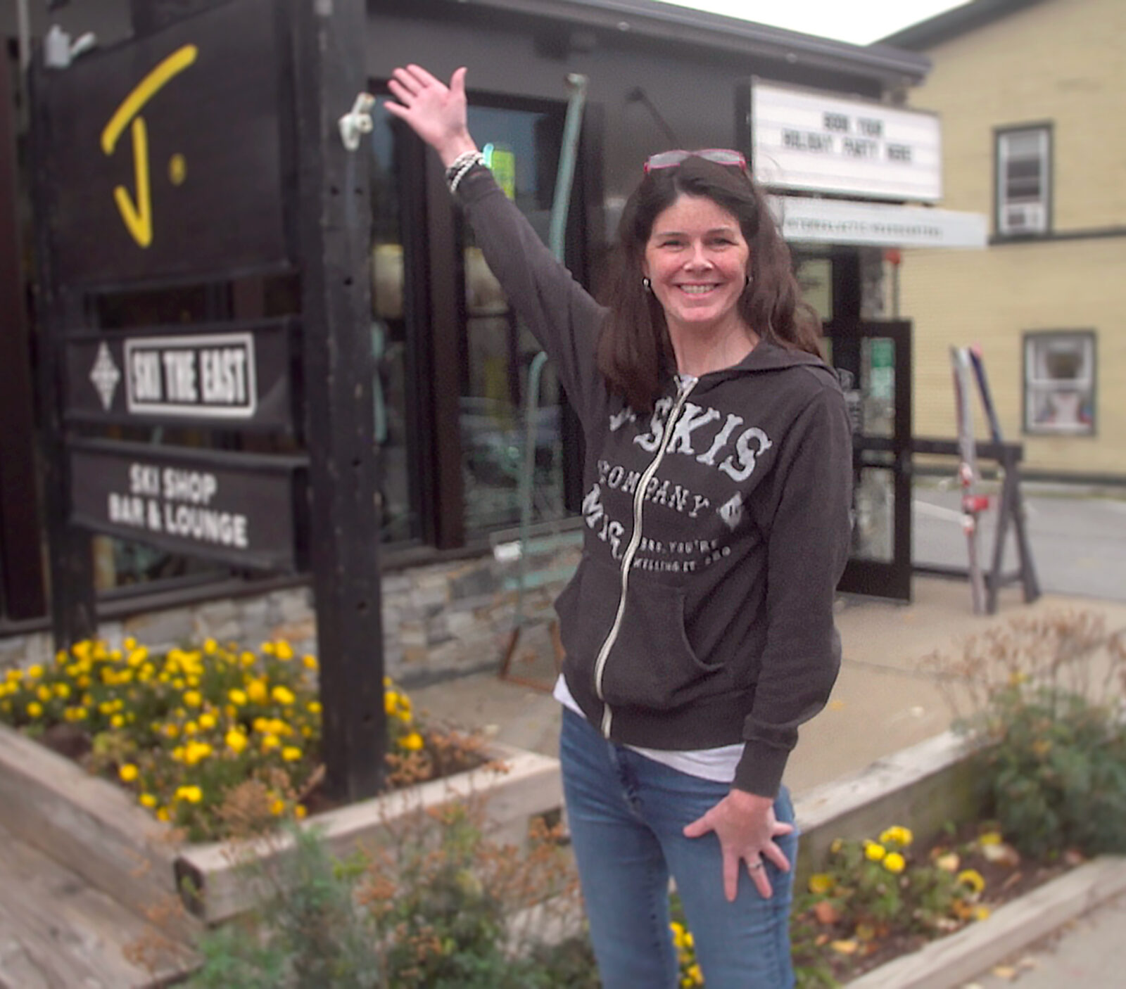 Corrine in front of the J skis and Ski The East Intergalactic Headquarters