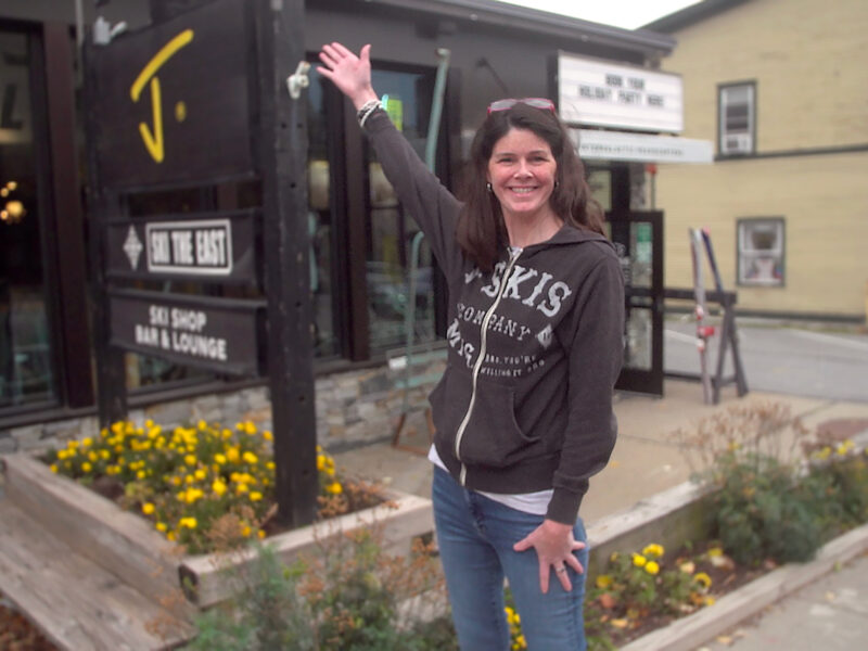 Corrine in front of the J skis and Ski The East Intergalactic Headquarters