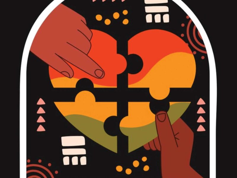 two hands putting together puzzle pieces to form a heart