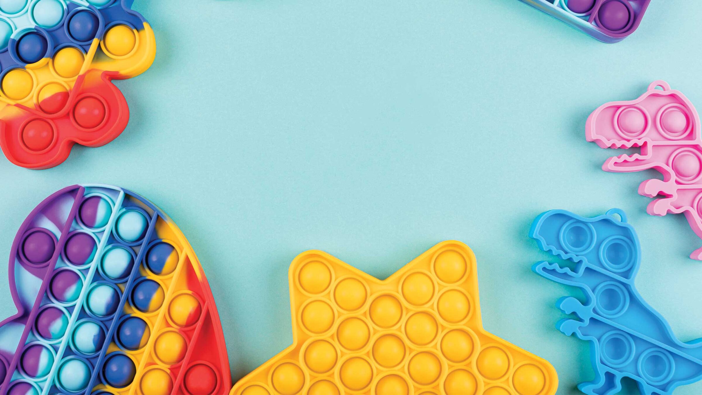 colorful fidget toys on a blue background