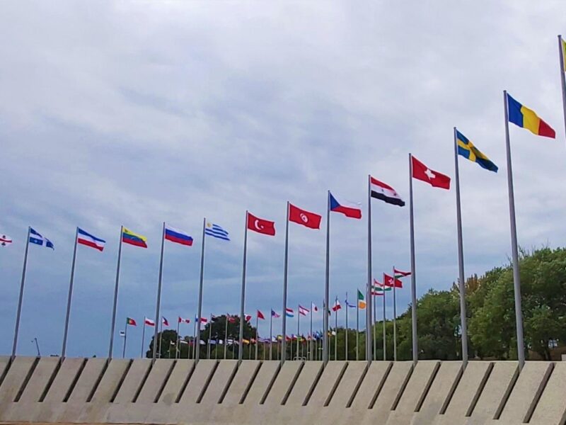 World flags outside blowing in the breeze