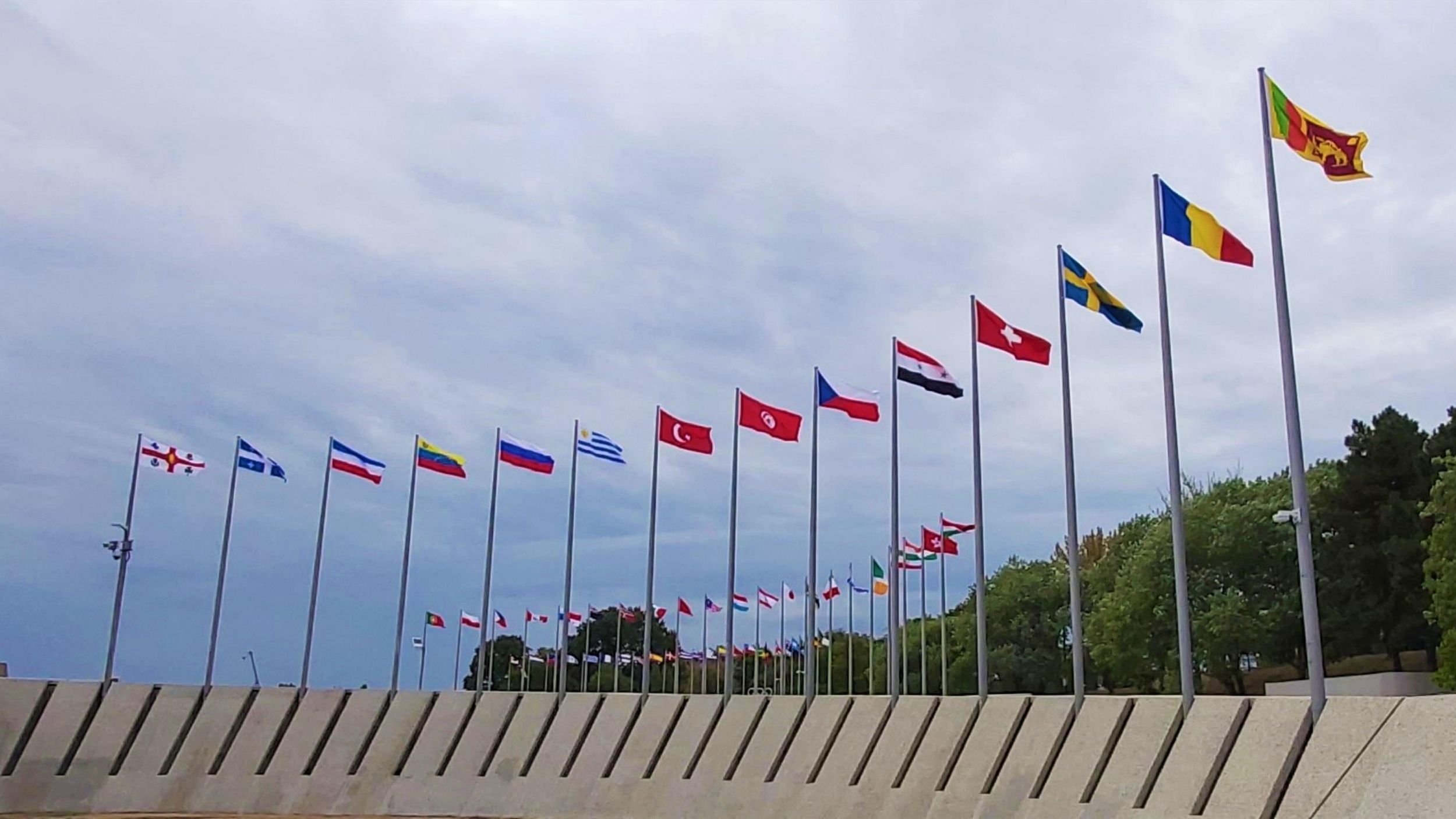 World flags outside blowing in the breeze
