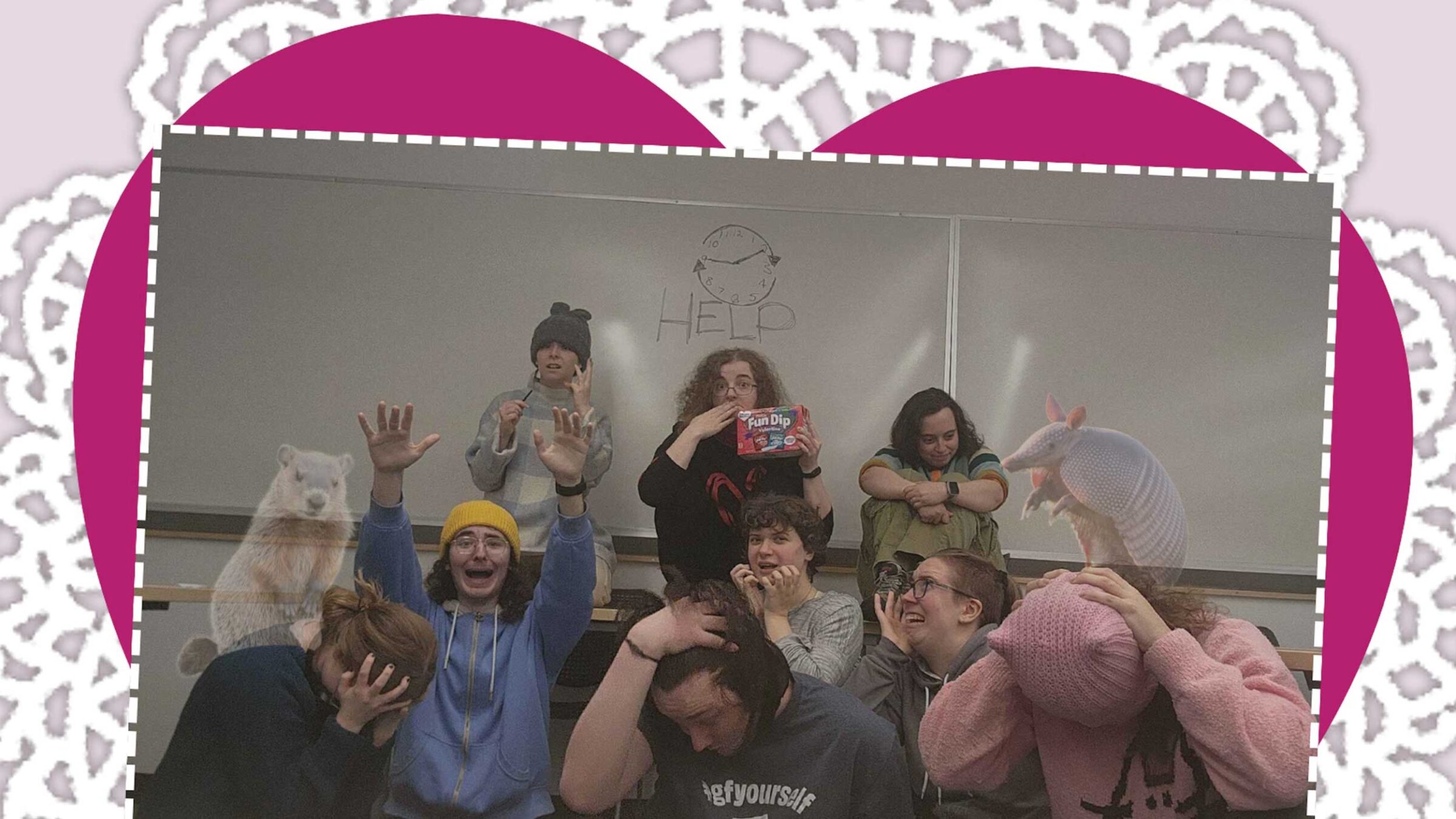 members of an imrpov team pose in a group picture with a valentines theme.