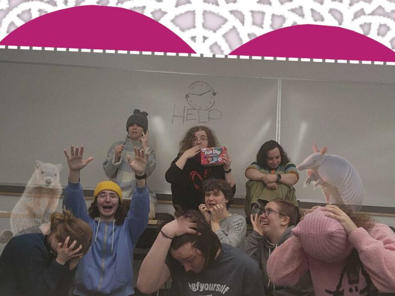 members of an imrpov team pose in a group picture with a valentines theme.