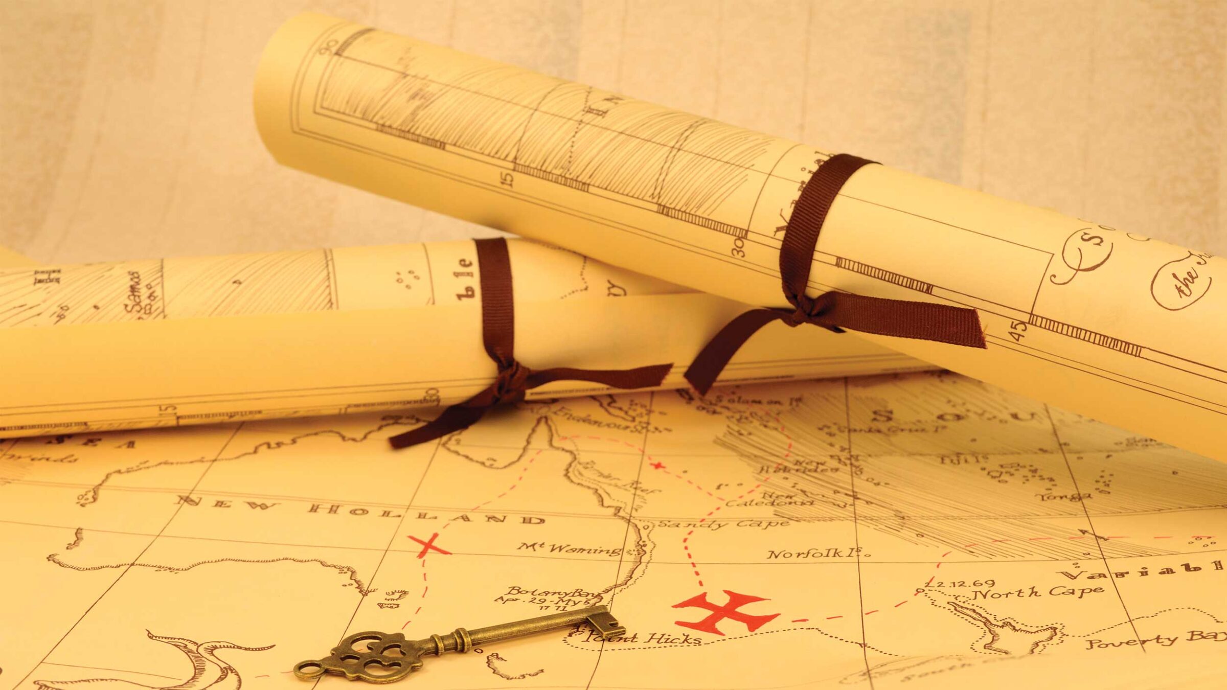 two map scrolls on a larger map with a key