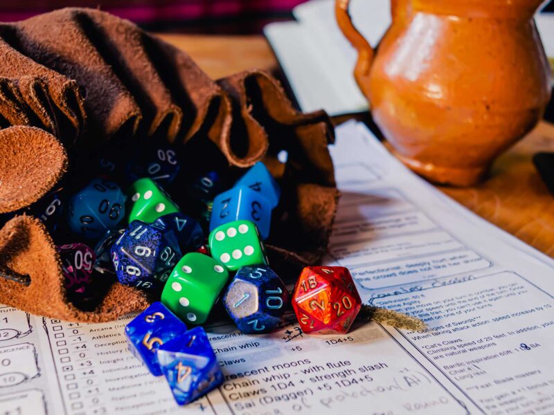 dnd dice in a bag on a character sheet