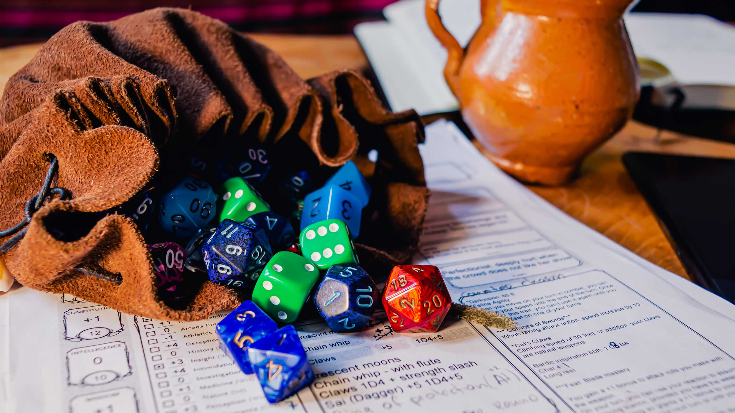 dnd dice in a bag on a character sheet