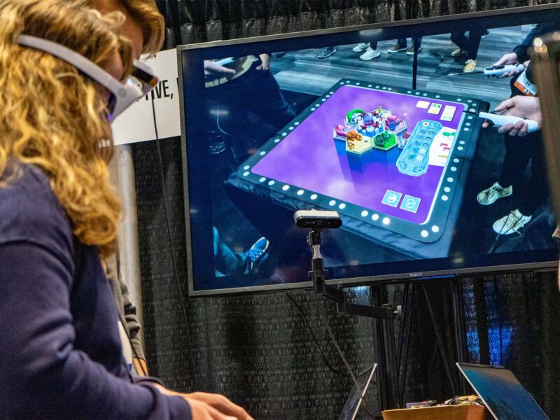 GDC attendees playtesting a game with headsets on