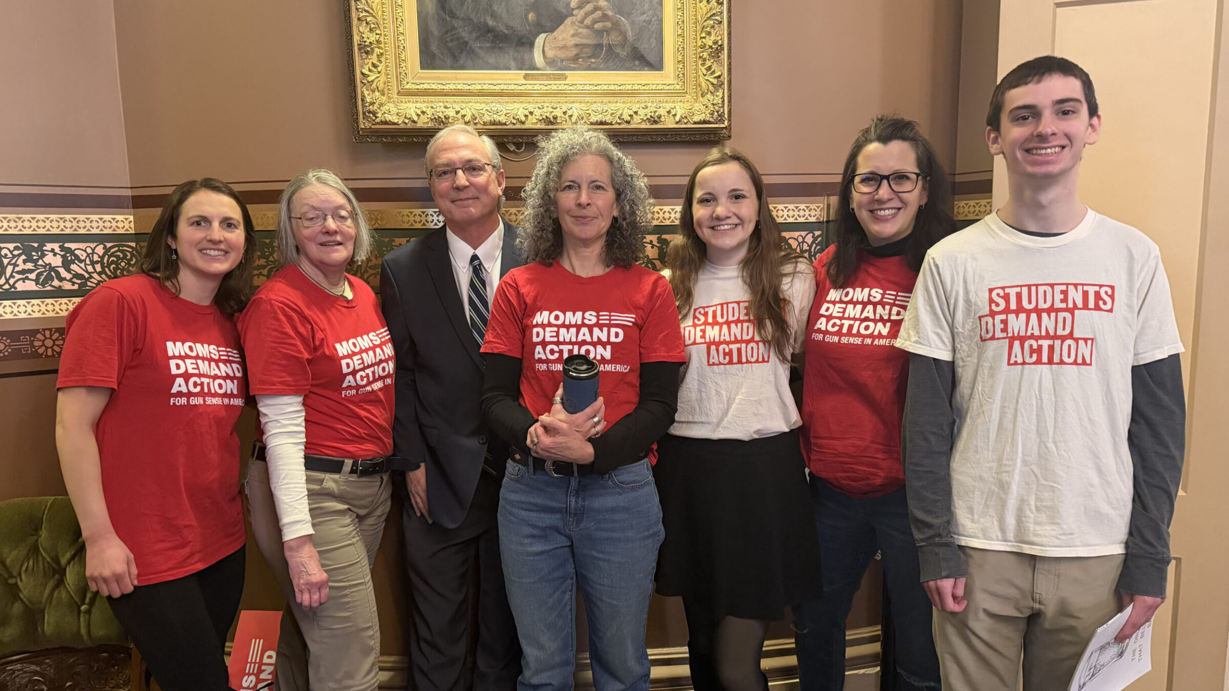 Students and parents of the Students Demand Action club taking a group photo inside