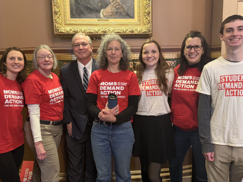 Students and parents of the Students Demand Action club taking a group photo inside