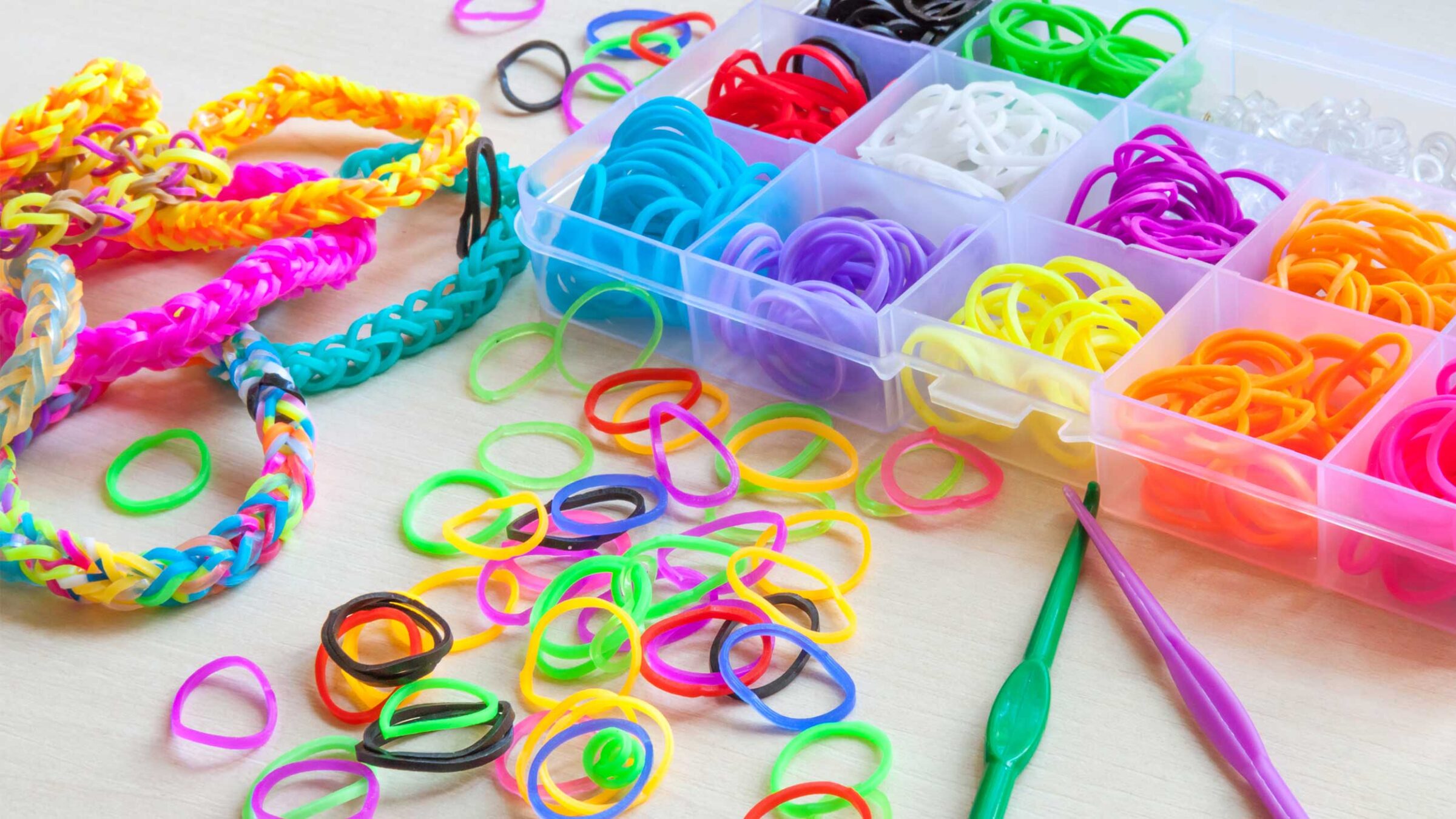 colorful rubber band bracelets and supplies