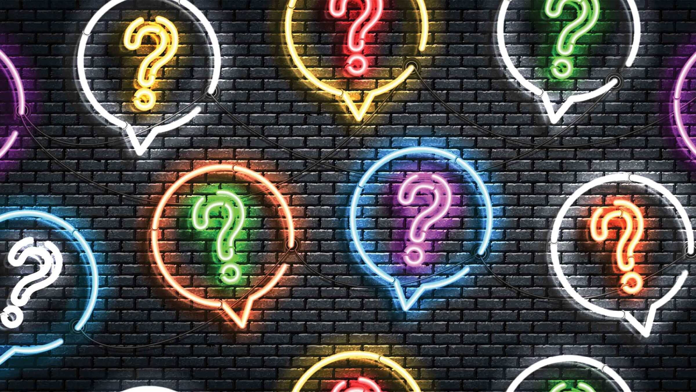 neon question marks against a dark background