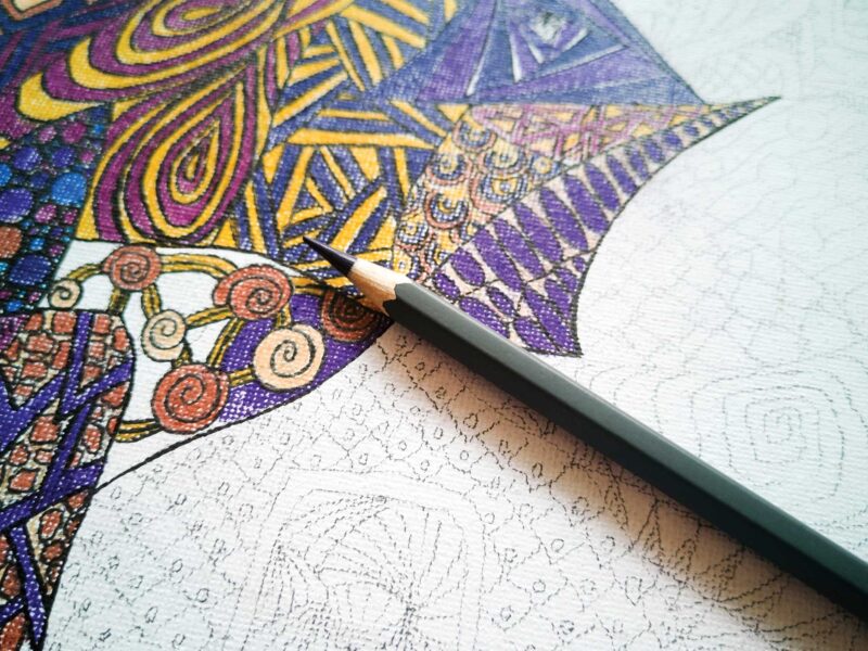 partially finished zentangle drawing with a colored pencil