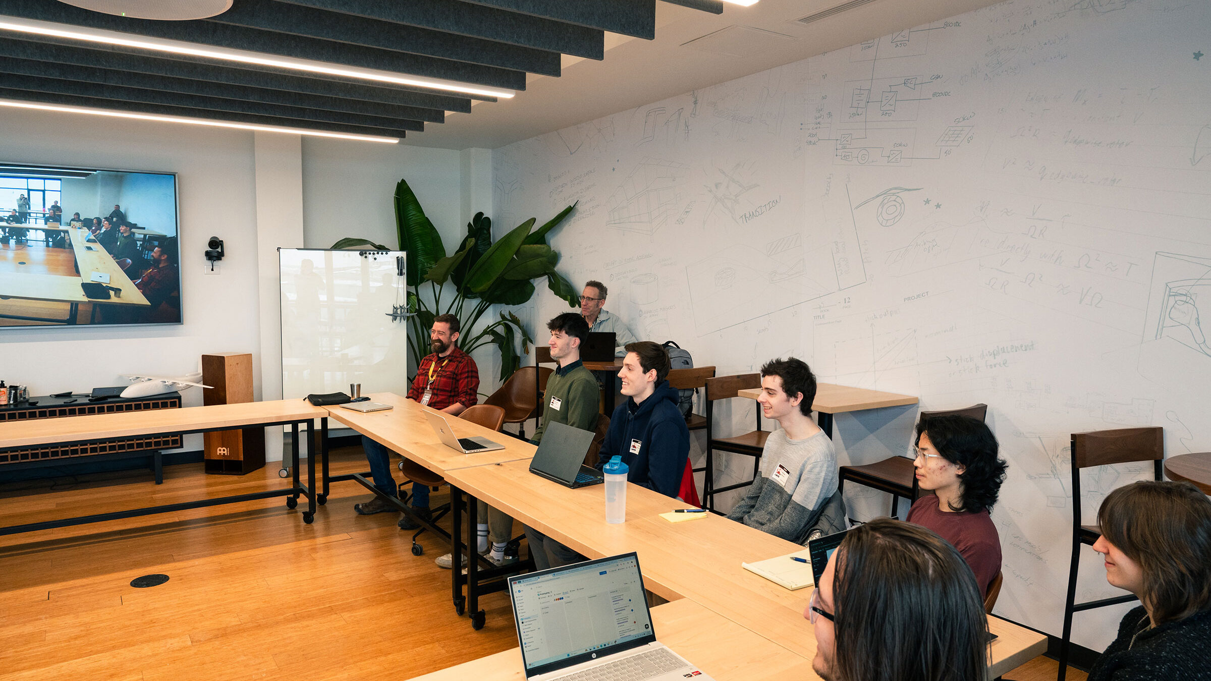 Champlain students visit BETA Technologies in Burlington, Vermont, and present to CEO Kyle Clark.