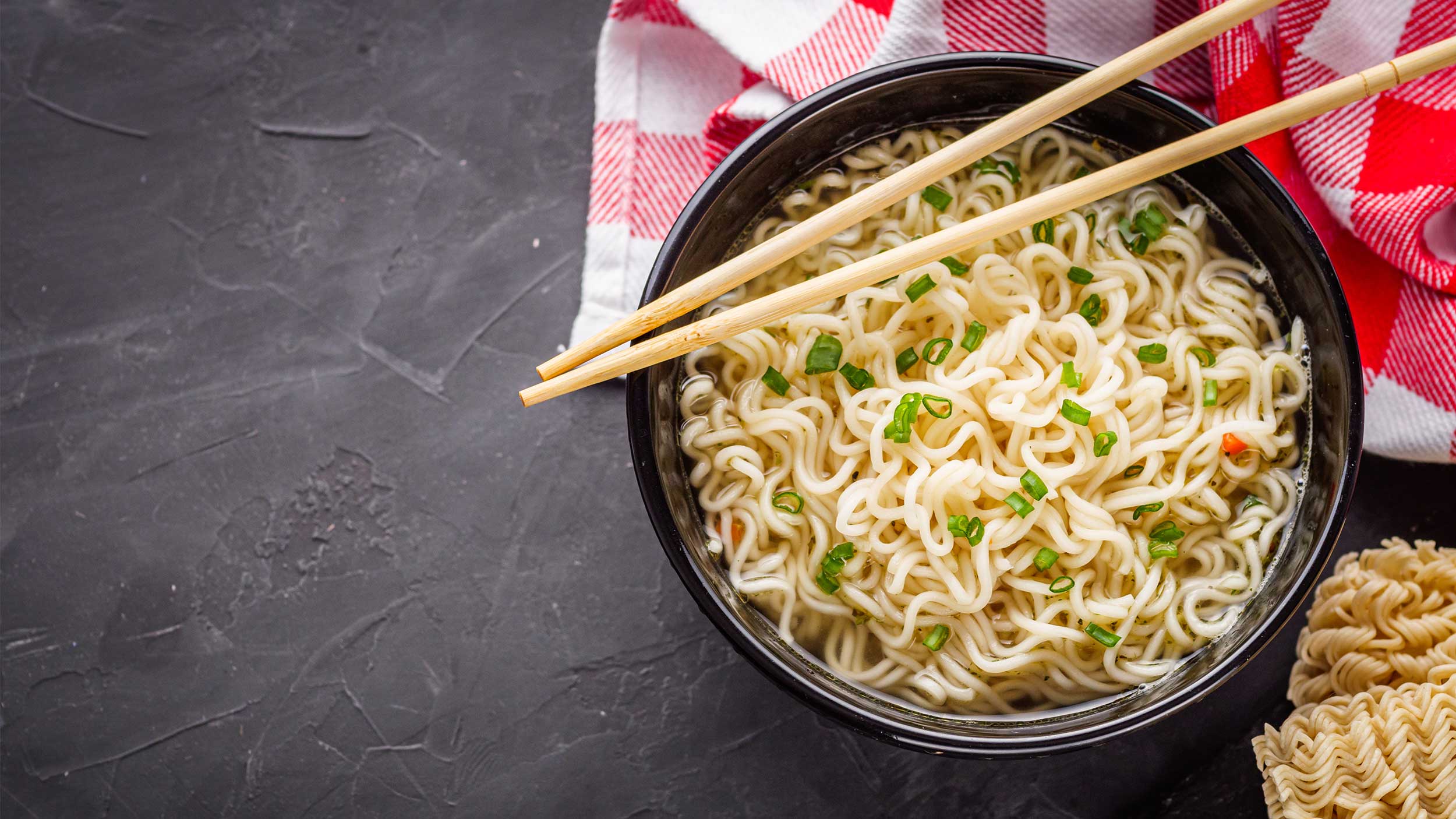 bowl of instant ramen with a pair of chopsticks