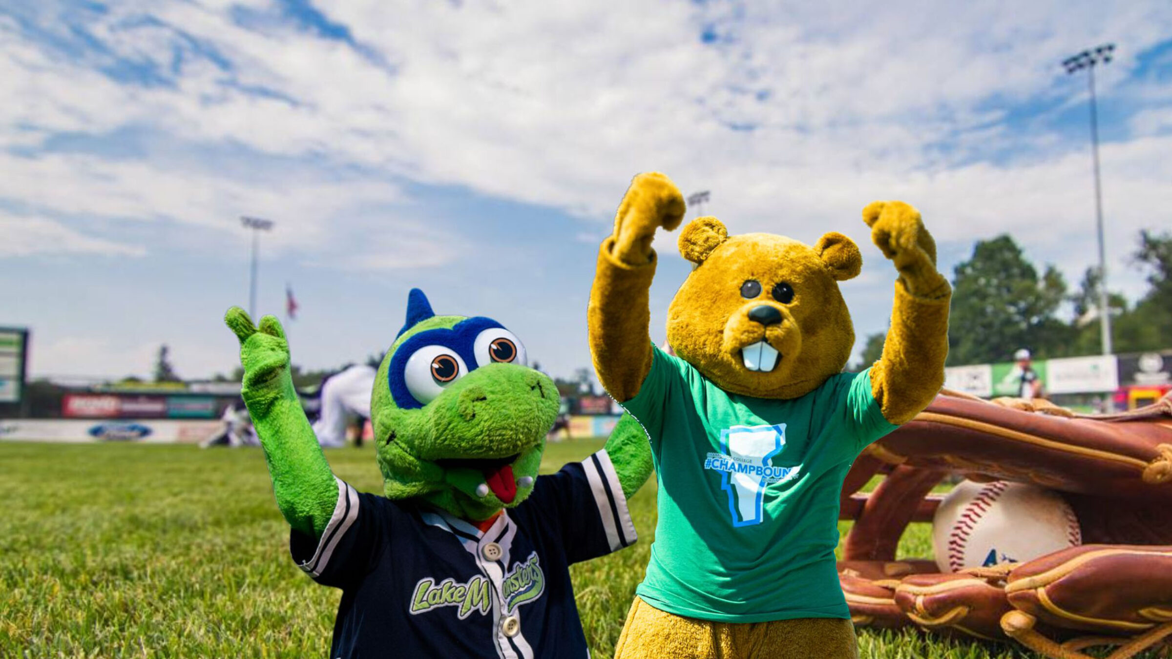 Chauncey posing with champ at a baseball field