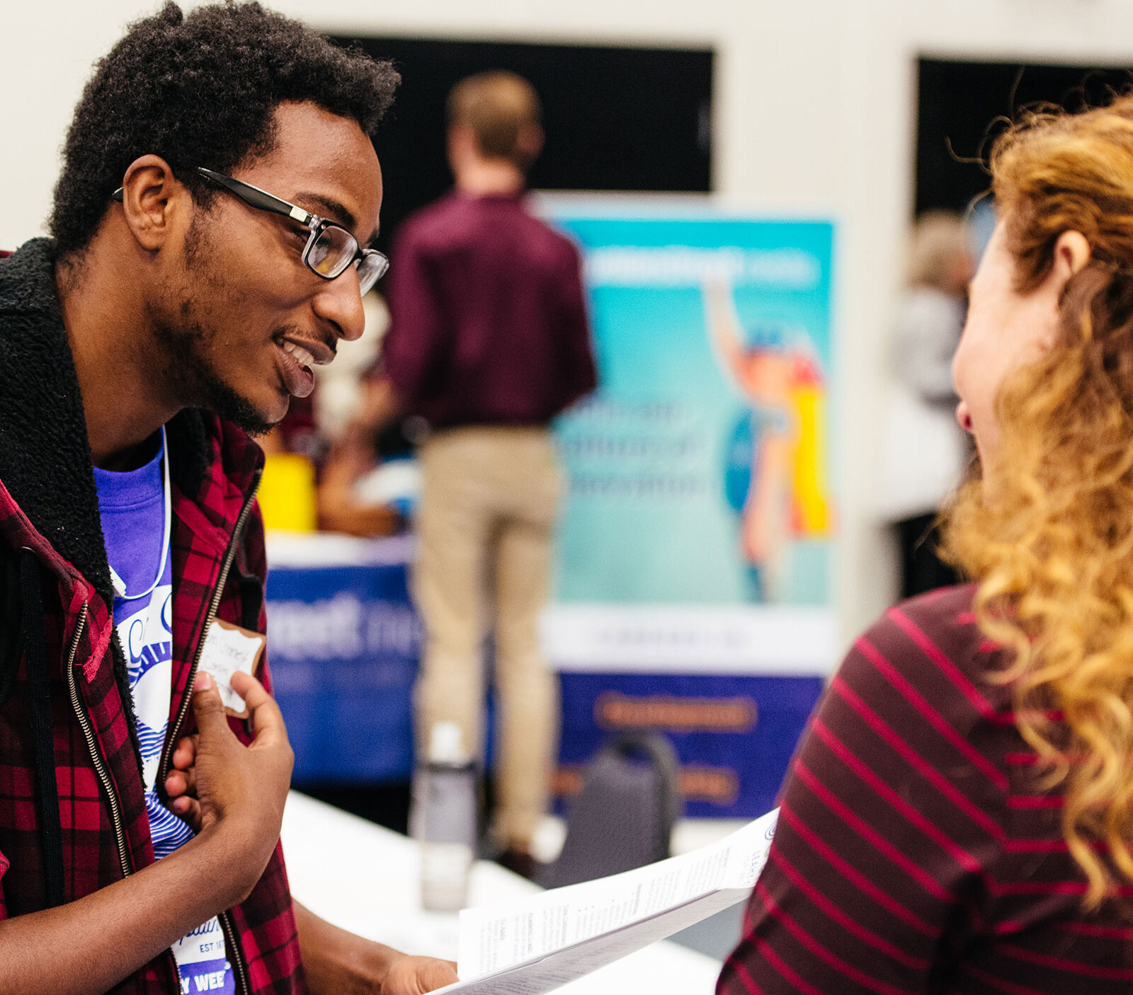 Student talks with an employer at a career fair