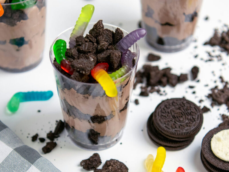 A stock image of a dirt cup with gummy worms