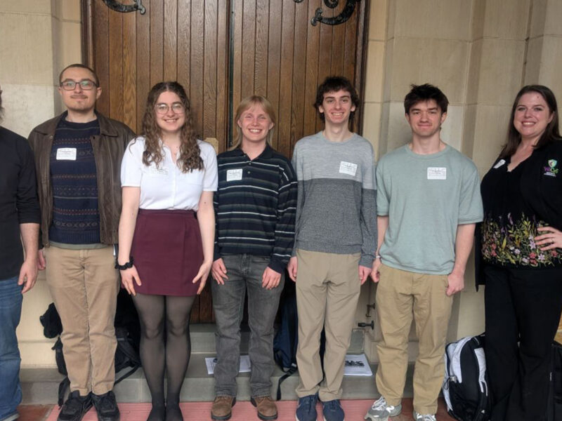 Champlain's math club group photo standing at the hudson river math conference
