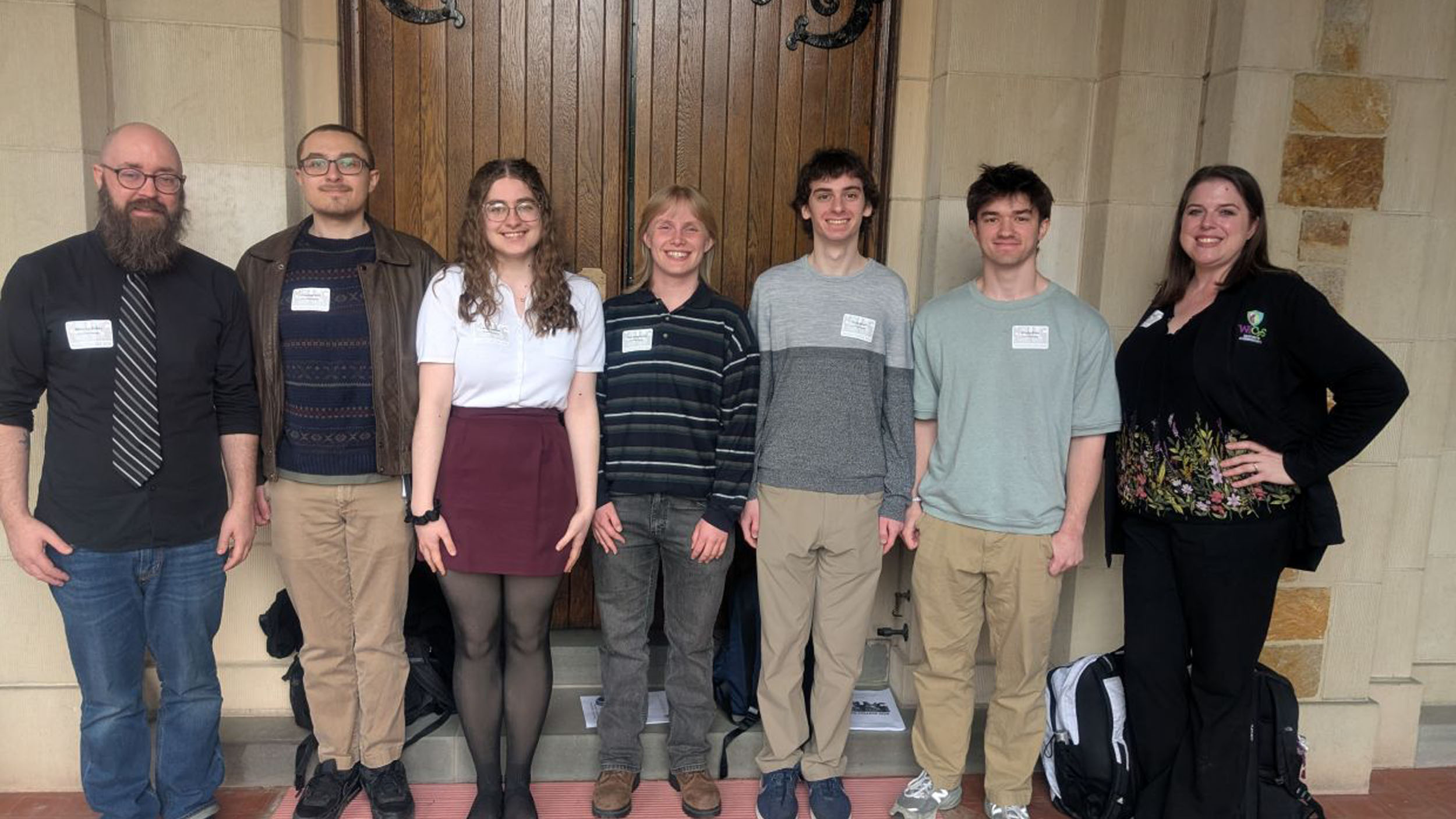 Champlain's math club group photo standing at the hudson river math conference