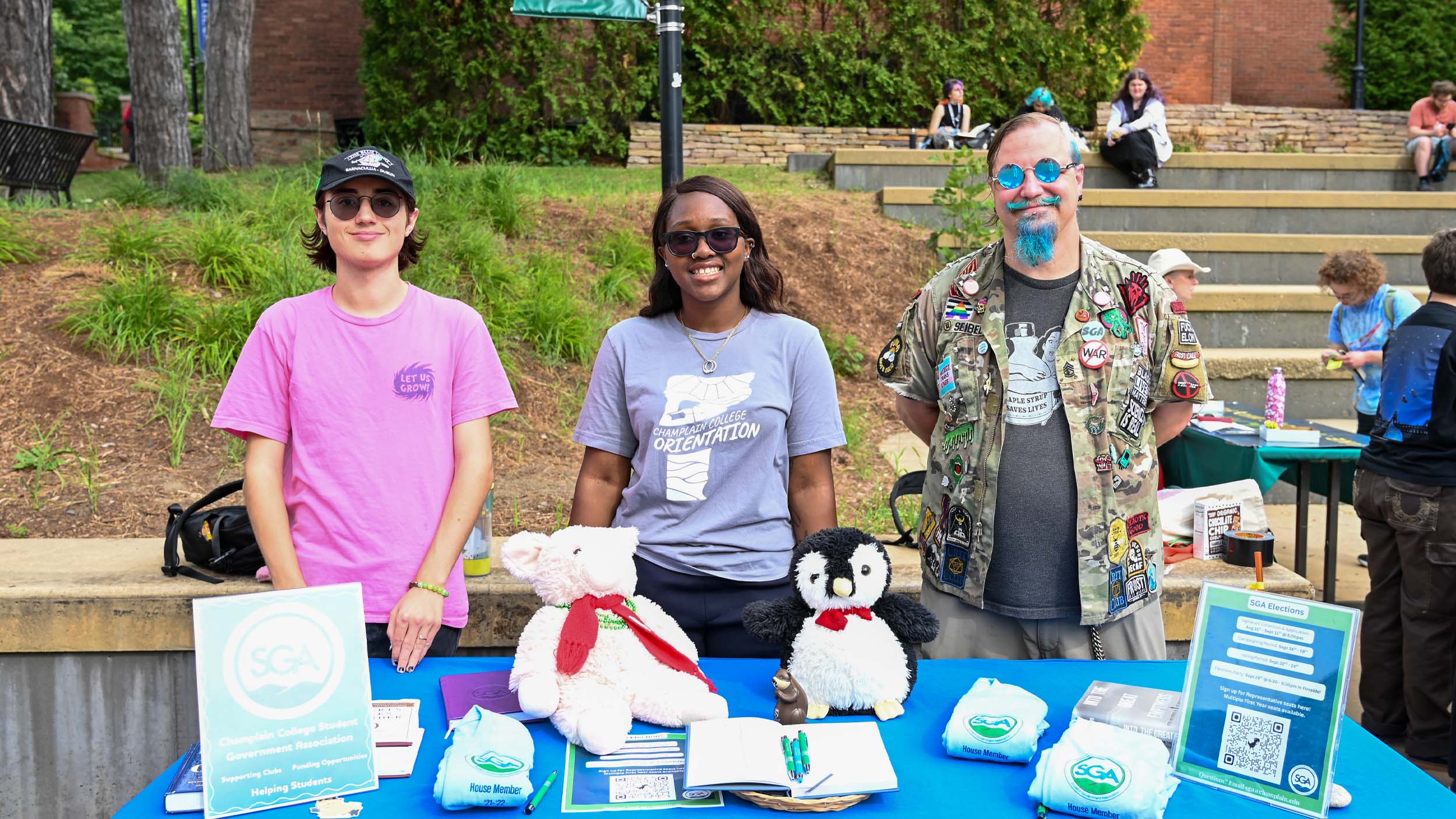 Students at the 2026 Fall activity fair around a table for the Student Government Association