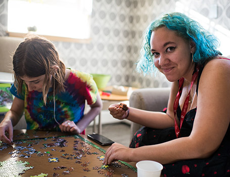 two students making a puzzle