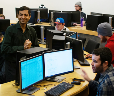 Students work at computers in a Computer & Digital Forensics class