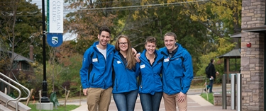 Four Student Ambassadors Standing Together Outside of CCM