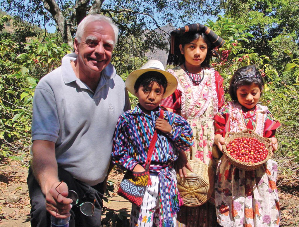 Bob Stiller with children in cofee bean field