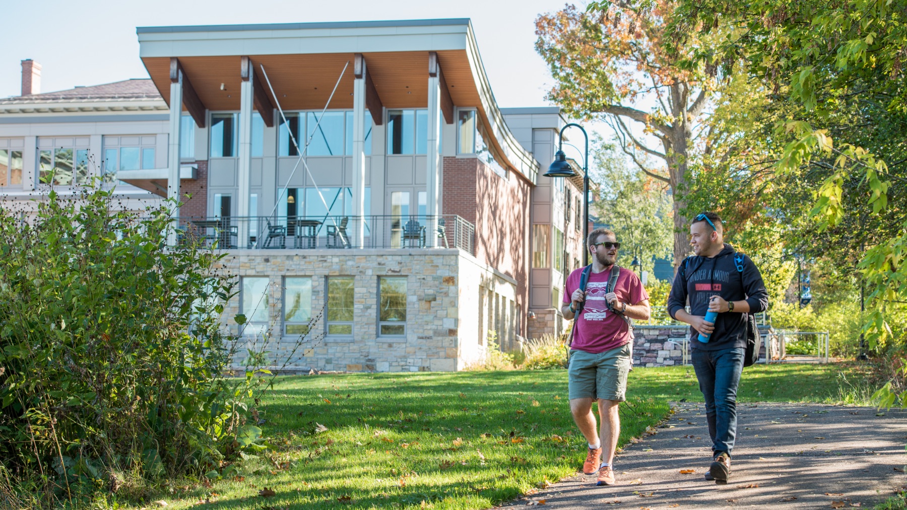Students walking beside Perry Hall at Champlain College in Burlington, Vermont