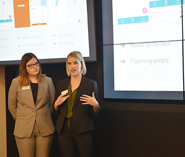 two female students giving presentation