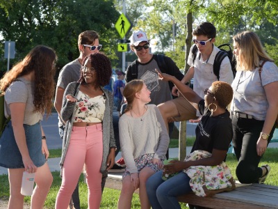 Students at Champlain College in Burlington, Vermont, enjoying a late summer day in a park.
