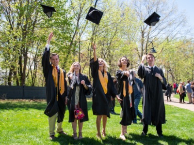 Students tossing their mortar boards at a Champlain College commencement ceremony in Burlington, Vermont.